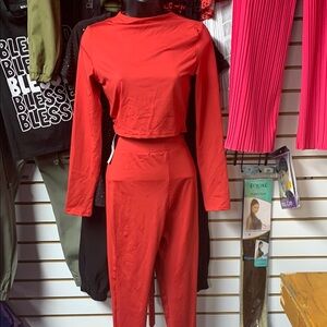 Sleek Red Jumpsuit with Mock Turtleneck and Tapered Pants